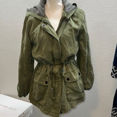 Army, Green Sanctuary Drawstring Lined With Oversized Pocket, Zip, And Button Jacket This Jacket Is Size, Small But Definitely Has An Oversize Fit Can Work For A Medium As Well Great Black And Gray, Striped Lining Accent On The Hood And Interior Lighting As Well As The Pockets. Plenty Of Space For All The Things. Trendy Olive Outerwear With Pockets, Oversized Green Parka For Fall, Trendy Utility Jacket With Pockets For Layering, Trendy Utility Jacket For Layering, Green Utility Outerwear For Fall, Olive Utility Outerwear For Fall, Oversized Trendy Long Sleeve Parka, Oversized Long Sleeve Spring Parka, Oversized Spring Parka