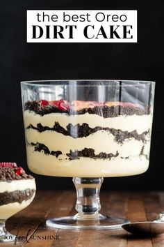 an oreo dirt cake in a glass dish on a wooden table with the words easy no - bake make ahead