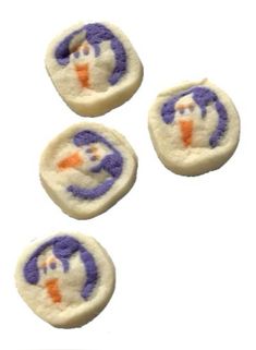 four small white and purple buttons with an image of a penguin on it's face