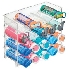 a clear plastic container filled with lots of different types of toothbrushes and other items