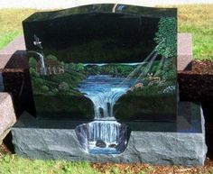 a painting on a stone with a waterfall in the middle