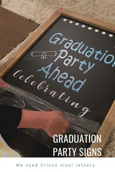 We used large chalkboard easels to make these graduation party signs for our grad party.  We placed them at the park entrance and along the road on the way to our party location.  Instead of chalk, we used removable Cricut vinyl.  This eased our minds because we were expecting some rain and chalk would have run and blurred if it had rained.  The grad party signs were the perfect addition to our graduation party decor. Kindergarten Graduation Party