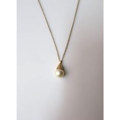 This is part of Chairish’s Fine Jewelry assortment.  A very beautiful white cultured pearl and 14-karat yellow gold necklace, circa mid-20th century. Pearl is very beautiful with a high luster. Pearl has a 14-karat yellow gold crown-like design attached to 14-karat yellow gold necklace. A beautiful piece to wear alone or stack with other necklaces. Very good condition as shown in images. No issues. Dimensions: pearl pendant is over 1/2" long x .25" Width. Necklace, from end to end, measures 19.2 Refined Yellow Gold Pearl Necklace For Wedding, Elegant 14k Gold Pearl Drop Necklace, Classic Single Strand Pearl Necklace In 14k Gold, Classic 14k Gold Pearl Necklace, Refined Yellow Gold Pearl Necklace, Timeless Gold Pearl Necklace For Wedding, Elegant Gold Single Strand Pearl Necklace, Timeless Yellow Gold Pearl Necklace For Anniversary, Elegant 14k Gold Pearl Necklace With Pearl Charm