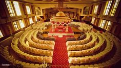 a large auditorium with rows of seats and tables