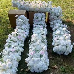 white flowers are arranged in the shape of letters