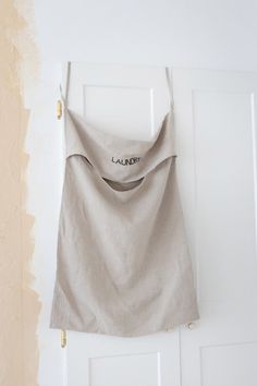 a skirt hanging on a door with the word la fabretta written on it