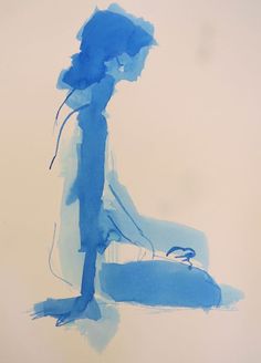 a person standing in front of a white wall with blue paint on it and a suitcase