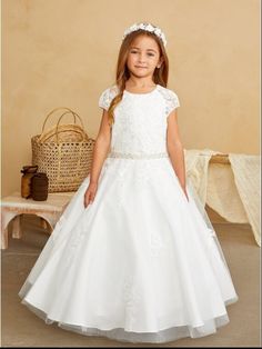 White Dress     Lace bodice with cap sleeves     Pearl and bead chevron pattern waist     Rear center zipper and sash tie back     Fully lined     Ankle length Lace bodice with cap sleeves and sparkling rhinestone waist White Baptism Dress With Lace Bodice For First Communion, White Fitted Bodice First Communion Dress With Short Sleeves, White First Communion Dress With Lace Bodice, Short Sleeve First Communion Dress With Lace Bodice, White Baptism Dress With Smocked Bodice For First Communion, White Short Sleeve First Communion Dress For Pageant, First Communion Lace Dress With Scalloped Details, White Baptism Dress With Lace Bodice For Dress-up, Ivory Girls Dress