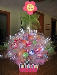 a basket filled with candies on top of a wooden table