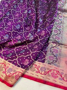 This is a very beautiful pure banarasi silk handloom saree . Cutwork weave , pure silk and rich pallu design . Saree length - 5.5 mtr. Blouse - 1 mtr.  Dry clean only . Please note - color may be vary a little due to sunlight and photography . Please message us after purchasing in case you want fall and Pico done it not . No extra charges for fall and Pico but inform us . Blouse stitching is also available . Purple Banarasi Silk Handloom Saree, Purple Paithani Silk Saree For Navratri, Navratri Purple Paithani Silk Saree, Purple Handloom Dola Silk Traditional Wear, Purple Katan Silk Saree With Self Design, Purple Handloom Traditional Wear In Dola Silk, Purple Paithani Silk Saree With Zari Weaving, Purple Paithani Silk Dupatta With Self Design, Purple Banarasi Silk Dupatta With Zari Weaving