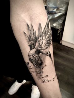 a tattoo with a bird on the arm