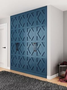 a blue cabinet in the corner of a room with a rug on the floor next to it