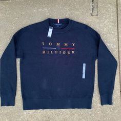 Brand New Perfect Condition Never Worn With Tags Msrp $119 Long Lasting Durable Material This Sweatshirt Has A Gorgeous Tommy Hilfiger Emblem On The Chest And Makes A Perfect Shirt For Any Casual Or Business Attire Outfit. Thick Durable Material And Long Sleeves To Keep You Warm Follow Me For More Discounted Items! Navy Winter Top With Ribbed Collar, Blue Cotton Top With Ribbed Collar, Blue Cotton Tops With Ribbed Collar, Navy Letter Print Sweater For Winter, Casual Blue Tops With Ribbed Collar, Casual Blue Top With Ribbed Collar, Blue Crew Neck Top For Fall, Blue Fall Streetwear Sweater, Blue Relaxed Fit Top With Ribbed Collar