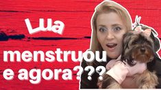 a woman holding a small dog in front of a red background with the words menstrouu e agora?