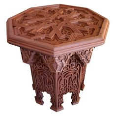 an intricately carved wooden table is shown