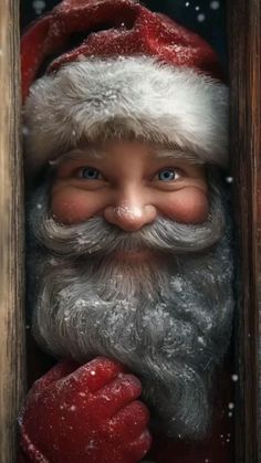 a close up of a santa clause with snow on his face