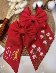 two red bows are sitting on a table