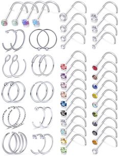 a bunch of different types of ear rings