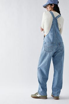 The perfect vintage-inspired overalls from Levi's, this distressed style is featured in a classic bib-and-brace silhouette with front pouch pocket and relaxed, straight leg design. * Adjustable straps * Four pocket design * Side button closures * Logo patch detail at front | Levi's Vintage Overalls at Free People in Light Wash, Size: XL Levis Overalls Outfit, Denim Overalls Outfit, Madewell Overalls, Levis Overalls, Blue Jean Overalls, Vintage Overalls, Overalls Outfit, Leg Design, Overalls Women