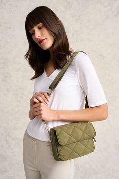 Great for travel or as an everyday accomplice, our Medina Soft Crossbody Bag in Khaki features elegant, quilted detailing at the front and a comfortable guitar strap. Storage includes a main zip compartment and outer slip pocket. Your next adventure awaits! Versatile Quilted Shoulder Bag For Everyday, Versatile Everyday Quilted Shoulder Bag, Versatile Quilted Everyday Bag, Everyday Quilted Satchel Shoulder Bag, Quilted Crossbody Bag For On-the-go, Quilted Crossbody Satchel For Everyday Use, Versatile Quilted Bag For Everyday Use, Quilted Crossbody Satchel For Travel, Versatile Quilted Shoulder Bag For On-the-go