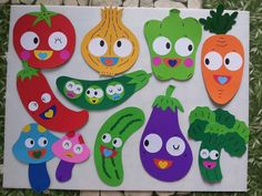 paper cut out of vegetables with faces on them