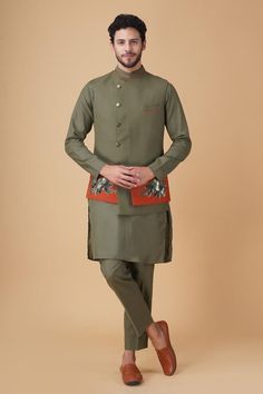 Green asymmetric panelled bundi jacket with placement hand embroidery. Paired with an inner kurta and pant.
Components: 3
Pattern: Placement Hand Embroidery
Type Of Work: Floral
Neckline: Stand Collar
Sleeve Type: Full Sleeves
Fabric: Ruby Silk
Color: Green
Other Details: 
Closure: Front buttons
Occasion: Sangeet - Aza Fashions Kurta Set For Men, Rohit Bal, Tarun Tahiliani, Nehru Jackets, Embroidery Floral, Manish, Kurta Set, Full Sleeves, Aza Fashion