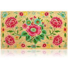 a door mat with flowers and leaves in pink, green, yellow and blue colors