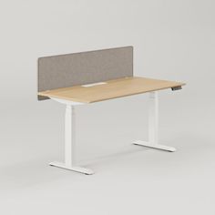 an office desk with a gray and white headboard on it's back end