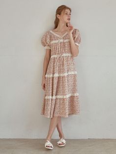 Calf-length dress in pretty floral fabric. Lace-trimmed V-neckline, puff short sleeves with lace trimming, and layered lace-trim dress. A-line with a gently ruffled hem. Unlined.- Midi- Short sleeve- V-neckline Short Sleeve Prairie Dress With Ruffles For Garden Party, Feminine Short Sleeve Midi Dress With Ruffles, Spring Prairie Dress With Ruffles And Short Sleeves, Elegant Short Sleeve Prairie Dress With Ruffles, Feminine Short Sleeve Prairie Dress For Spring, Feminine Spring Prairie Dress With Short Sleeves, Feminine Ruffled Prairie Dress For Daywear, Tiered Midi Dress With Lace Trim For Garden Party, Daywear Short Sleeve Dresses With Lace Trim