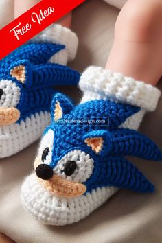 a crocheted blue and white kitten slippers