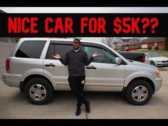 a man standing in front of a white suv with the words nice car for $k?