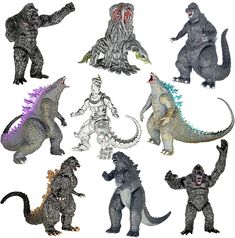 an assortment of godzilla action figures on a white background