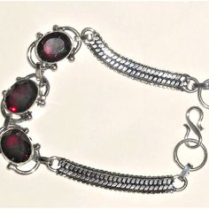 Natural Garnet Bracelet I Paid $80 For And Never Wore It. Selling For Less Than ½ The Price In My Salon Boutique. Stamped .925 Solid Sterling Silver. Fits Wrist 8-8½. Fastens With Classic S Shaped Clasp Style. This Is A Very Fair Price. You Can Bundle More Items, P To 5 Lbs And Pay Only One Time For S&H. I Don't Often Send Offers To Likers. Please Visit Our Sister Closet: @Gems_of_glory Thanks For Looking. #Red Garnet #Sterling Silver Nickel-free Red Sterling Silver Bracelet, Adjustable Red Oval Bracelet, Handmade Silver Garnet Bracelets, Adjustable Red Oval Bracelets, Red Garnet Bracelets As Gift, Red Garnet Bracelet As Gift, Red Garnet Bracelet Gift, Red Garnet Bracelet For Gift, Adjustable Silver Ruby Bracelet