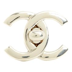 Chanel brooch SS1996 collection (!) with the motif of a large CC Chanel logo in silver metal, slanted pin on the back, signed. Width 3.8 cm x length 2.9 cm. The brooch has a few scratches from use but it is in very good vintage condition, delivered without invoice or original packaging, perfect on a jacket, a bag flap, as a belt buckle\. This piece has an attribution mark,   I am sure that it is completely authentic and  take full responsibility for any authenticity   issues arising from misattribution Elegant Formal Jewelry With Logo Plaque, Silver Metal Jewelry With Logo, Silver Metal Jewelry With Metal Logo, Luxury Silver Jewelry With Metal Logo, Silver Elegant Enamel Pin For Formal Use, Luxury Silver Brooches, Silver Lapel Pin With Metal Pinmount Logo For Gift, Silver Elegant Enamel Pin For Formal Events, Elegant Silver Enamel Pin For Formal Occasions