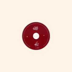 a red disc with the word act on it's front and back side, against a white background