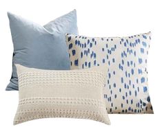 four pillows with blue and white designs on them