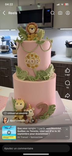 a three tiered cake decorated with animals and leaves