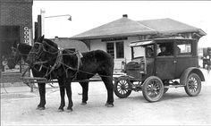 an old black and white photo of a horse drawn carriage