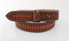 --- Leather Belt Width: 1.5" --- Premium Full-Grain Leather. --- Belt thickness 3.2 mm --- Easy Snap System for Interchanging Buckles --- Each product is one-of-a-kind and made from part of a whole hide of leather. The frontside is smooth and finished while the backside contains the grain fibers that indicate a true leather product. There will be unique variation from item to item that truly makes it your own.  The Perfect Fit: ---  Take an old belt (that still fits) and measure from the base of Adjustable Embossed Leather Belt, Adjustable Engraved Brown Belt, Western Leather Embossed Belt Buckles, Classic Hand Tooled Leather Belt Buckles, Traditional Brown Leather Belt Buckles, Classic Brown Embossed Belt Buckles, Classic Brown Hand Tooled Belt Buckles, Classic Hand Tooled Brown Belt Buckles, Traditional Hand Tooled Leather Belt Buckles