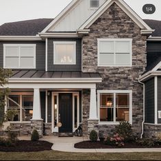 the front of a house with two story windows