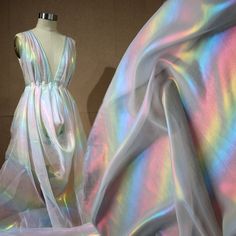 Wholesale Iridescent Magic Color Chiffon Fabric,Girl Dress Gauze,Wedding Decor,Fashion Designer Fabric, Note: This listing only is for 1 yard shiny fabric. Maybe a little color difference because of the light and different computer display. Width: About 150cm Length: This listing is for 1 yard. You will get a continue piece, if you buy more than 1 yard. Weight: About 60g / yard Feature: Iridescent Color Chiffon Fabric. Soft Smooth! You will see different color at different angles and light This Soft Summer Dress, Chifon Dress, Holographic Dress, Party Decor Diy, Holographic Fabric, Iridescent Fabric, Dance Outfit, Shiny Fabric, Organza Dress