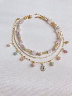 🌟 Gemstone necklace Freshwater pearl jewelry Rainbow  Real pearls Natural gemstone (morganite, pink quartz) Gold plated brass chain and claps Features a gold plated brass clasp Adjustable length: 40-48 cm for the perfect fit Pearls exhibit varying sizes and shapes, enhancing their uniqueness 🌿 Care Instructions: Delicate and elegant, these products require gentle handling to prevent breakage. Make sure it is properly cleaned, polished, and stored away from water, chlorine, or chemicals such as perfumes or lotions. 🔨 Handcrafted Excellence: Each piece is meticulously handcrafted and made to order, ensuring uniqueness and minor differences that enhance its charm. 📦 Shipping Details: Enjoy worldwide shipping! Each order is carefully hand-packed, promising a delightful surprise. Estimated Pulseras Kandi, Freshwater Pearl Jewelry, Handmade Wire Jewelry, Jewelry Lookbook, Real Pearls, Pearl Set, Beaded Accessories, Delicate Jewelry, Evil Eye Necklace