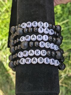 Handmade men's Ghanaian day name bracelet.  Made with matte black onyx beads and black glass beads. Black Spiritual Jewelry With Letter Beads, Personalized Black Beaded Bracelets, Adjustable, Personalized Black Bracelets With Round Beads, Personalized Black Bracelet With Round Beads, Casual Black Stretch Bracelet With Letter Beads, Black Letter Round Beads, Black Personalized Name Bracelet With Round Beads, Custom Name Black Wristband As Gift, Personalized Black Name Bracelet With Round Beads