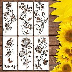 sunflower stencils are shown on a wooden table next to some yellow flowers