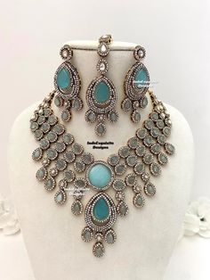 Elegant Bollywood style Victorian Monalisa stones necklace comes with statement Earrings and Tikka/ Indian Jewelry/Premium Quality Polki and Kundan Jewelry/sky blue/ferozi/feroza     All items are shipped from Brampton, Ontario, Canada. If you need your item by a certain day, please reach out to us for express delivery option before placing the order so that we can update the shipping for you. Standard shipping/delivery timeline Below are the delivery timeline estimates. We dispatch all orders b Blue Bridal Necklace With Intricate Design For Weddings, Traditional Turquoise Jewelry Sets For Wedding, Festive Turquoise Bridal Necklace For Wedding, Festive Turquoise Bridal Necklace, Turquoise Jewelry With Stone Work For Wedding, Turquoise Kundan Bridal Necklace For Wedding, Turquoise Stone Work Jewelry For Wedding, Tikka Indian Jewelry, Brampton Ontario