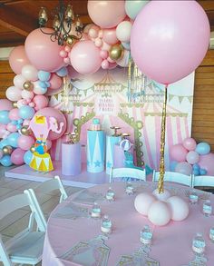 a pink and gold birthday party with balloons