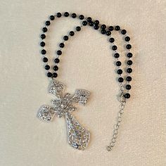 Silver Gothic Cross Necklace Beautiful Statement Piece, Gothic Cross Pendant Embedded With Sparkling Cubic Zirconia Gemstones On A Black Beaded Choker Necklace. *Cross Charm Size: 7x5cm *Necklace Length: 34cm+5cm Extension Chain. *Brand New. Will Ship Next Day Or Same Day If Possible. Make A Bundle Of 2 Or More Items And Save $2 (Message Me First!) #Bigcross #Crystaljewelry #Rosarynecklace #Crossnecklace #Grungenecklace Tags: Gothic Cross Necklace Handmade Jewelry Handmade Necklace Crystal Jewel Silver Beaded Necklaces With Bling For Gifts, Elegant Cross Rhinestone Necklace For Parties, Elegant Cross-shaped Rhinestone Necklace For Parties, Cross-shaped Rhinestone Jewelry For Parties, Cross Shaped Rhinestone Jewelry For Parties, Beaded Rhinestone Necklace Costume Jewelry Gift, Cross Shaped Rhinestone Party Jewelry, Cross Necklace With Rhinestones For Party, Party Cross Necklace With Rhinestones