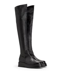 Item made in Italy, synonymous with quality and design creativity..100% Ovine leather.These solid-color leather boots are characterized by a round-toe silhouette and a thick rubber sole. Made in Italy, they’re cut to sit above the knee..Boot length 22.23 inches, Boot width 13.26 inches, Heel height 2.15 inches, Platform height 1.36 inches Leather Knee-high Boots With Leather Sole, Leather Platform Knee-high Boots, Leather Knee-high Moto Boots With Lug Sole, Leather High Ankle Platform Boots With Vibram Sole, High Ankle Leather Platform Boots With Vibram Sole, Leather Knee-high Platform Boots, Leather Knee-high Boots With Lug Sole, Leather Knee-high Boots With Platform And Round Toe, Leather Knee-high Platform Moto Boots