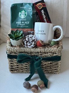 a basket with coffee, cookies and other items