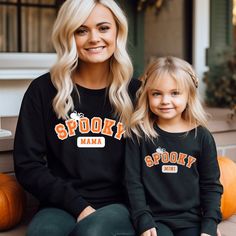 Spooky Mama and Mini Halloween Sweatshirt Mommy And Me Halloween Sweatshirts Mommy And Me Shirts Mom And Me Sweater Mother Daughter Outfits GILDAN 18000 (Adult Sweatshirt) and GILDAN 18000B (Youth Sweatshirt) These sweaters are made from polyester and cotton. This combination helps designs come out looking fresh and beautiful.  The collar is ribbed knit, so it retains its shape even after washing.   Knit in one piece using tubular knit, it reduces fabric waste and makes the garment more attractive.  There are no itchy side seams on these sweaters.  .: 50% Cotton 50% Polyester .: Medium-heavy fabric 8.0 oz. .: Loose fit .: Sewn in label .: Runs true to size Care Instructions:  Machine wash: Turn inside out. Warm (max 40C or 105F); Non-chlorine: bleach as needed; Tumble dry: medium heat; Do Family Matching Black Tops For Fall, Black Family Matching Tops For Fall, Mother Daughter Outfits, Mommy And Me Shirt, Mommy And Me Outfits, Girl Mom, Halloween Sweatshirt, Mother Daughter, Kids Sweatshirt